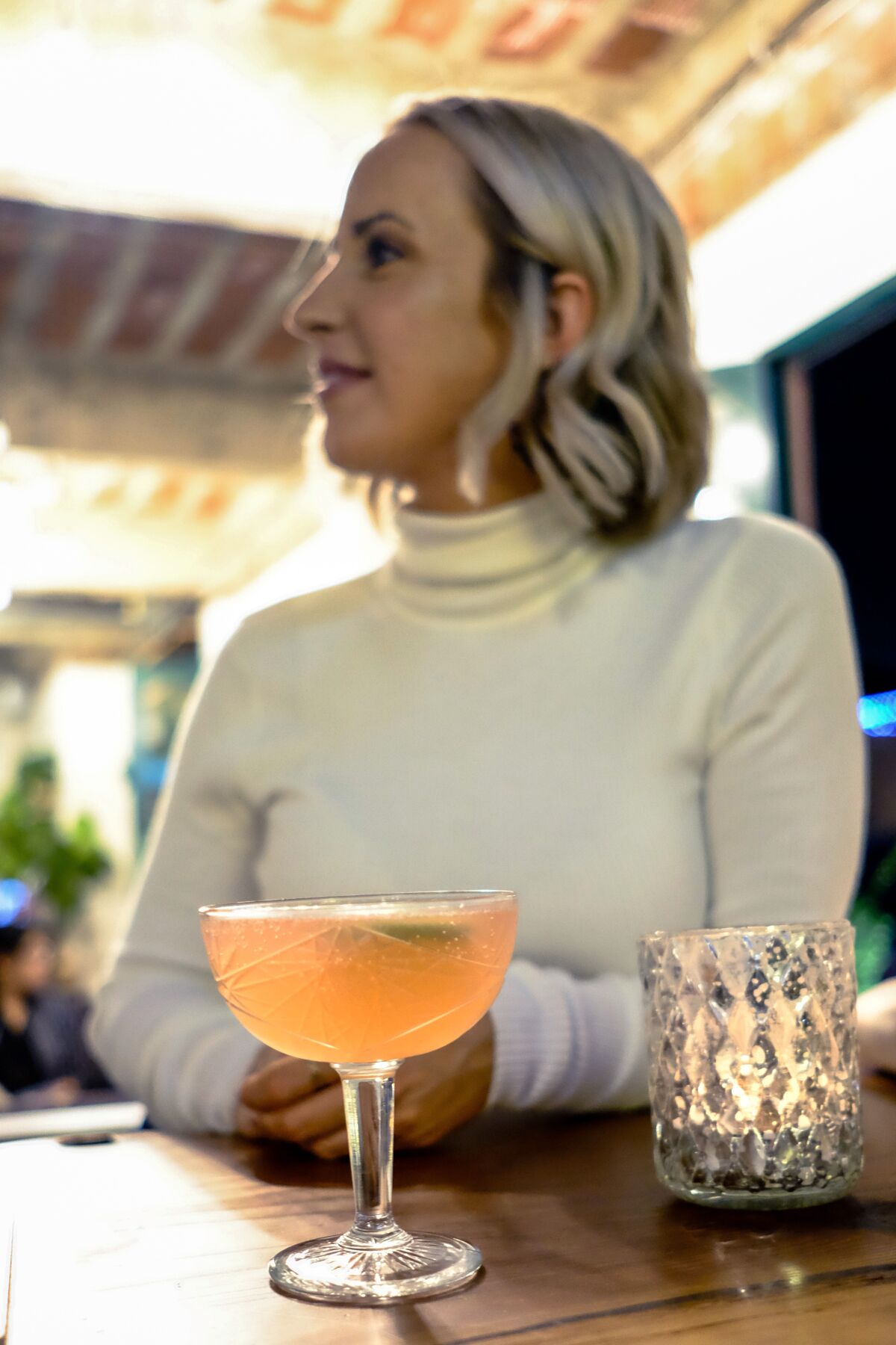 Katlyn receives her cocktail.