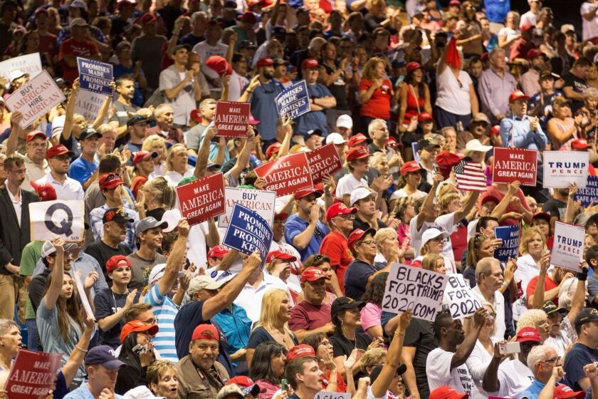 Mandatory Credit: Photo by ROD MILLINGTON/EPA-EFE/REX/Shutterstock (9775272aa) People cheer as US President Donald J. Trump (not pictured) speaks at the Florida State Fairgrounds Expo Hall in Tampa, Florida, USA, 31 July 2018. Trump continues to hold rallies around the country in support of his agenda and candidates running in the mid-term elections. US President Donald J. Trump rally in Tampa, Florida, USA - 31 Jul 2018 ** Usable by LA, CT and MoD ONLY **