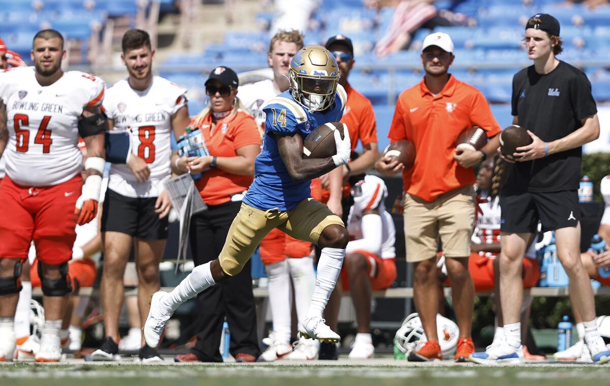 UCLA receiver Josiah Norwood breaks down the sideline for a 50-yard touchdown against Bowling Green.