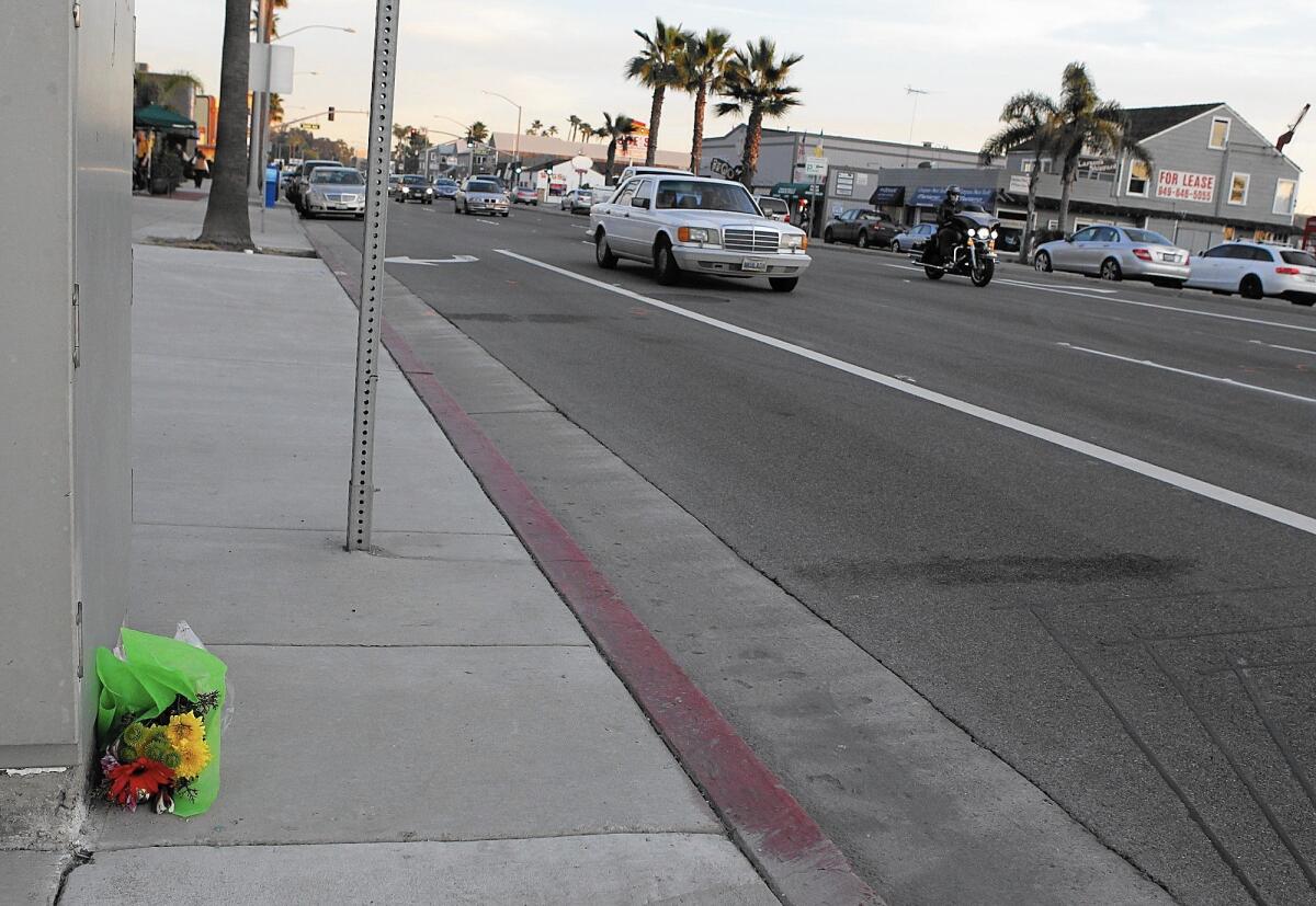 A small bouquet of flowers marks the site of a fatal accident on Pacific Coast Highway in Newport Beach in 2011.