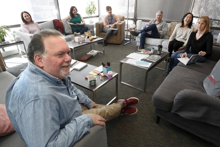 SHERMAN OAKS, CA-November 26, 2018: Clockwise from bottom left-Executive producer Bruce Miller, supervising producer Marissa Jo Cerar, executive story editor Lynn Renee Maxcy, supervising producer Dorothy Forten Berry, executive producer Eric Tuchman, executive producer Yahlin Chang, and executive producer Kira Snyder, are photographed during a meeting in the writer's room of Hulu's critically-acclaimed drama, "The Handmaid's Tale." (Mel Melcon/Los Angeles Times)