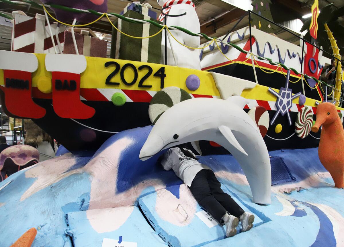 Volunteers work on the final touches on Newport Beach's float.
