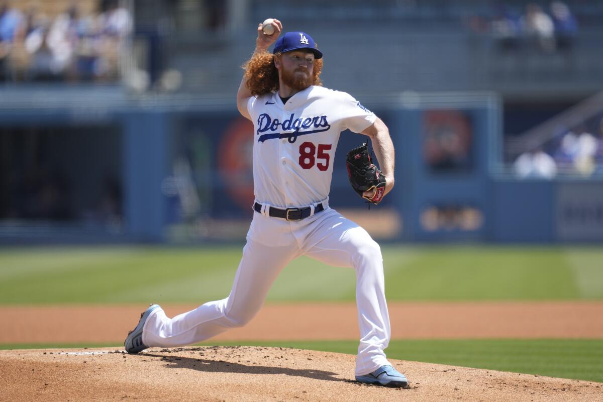 Dodgers starting pitcher Dustin May throws.