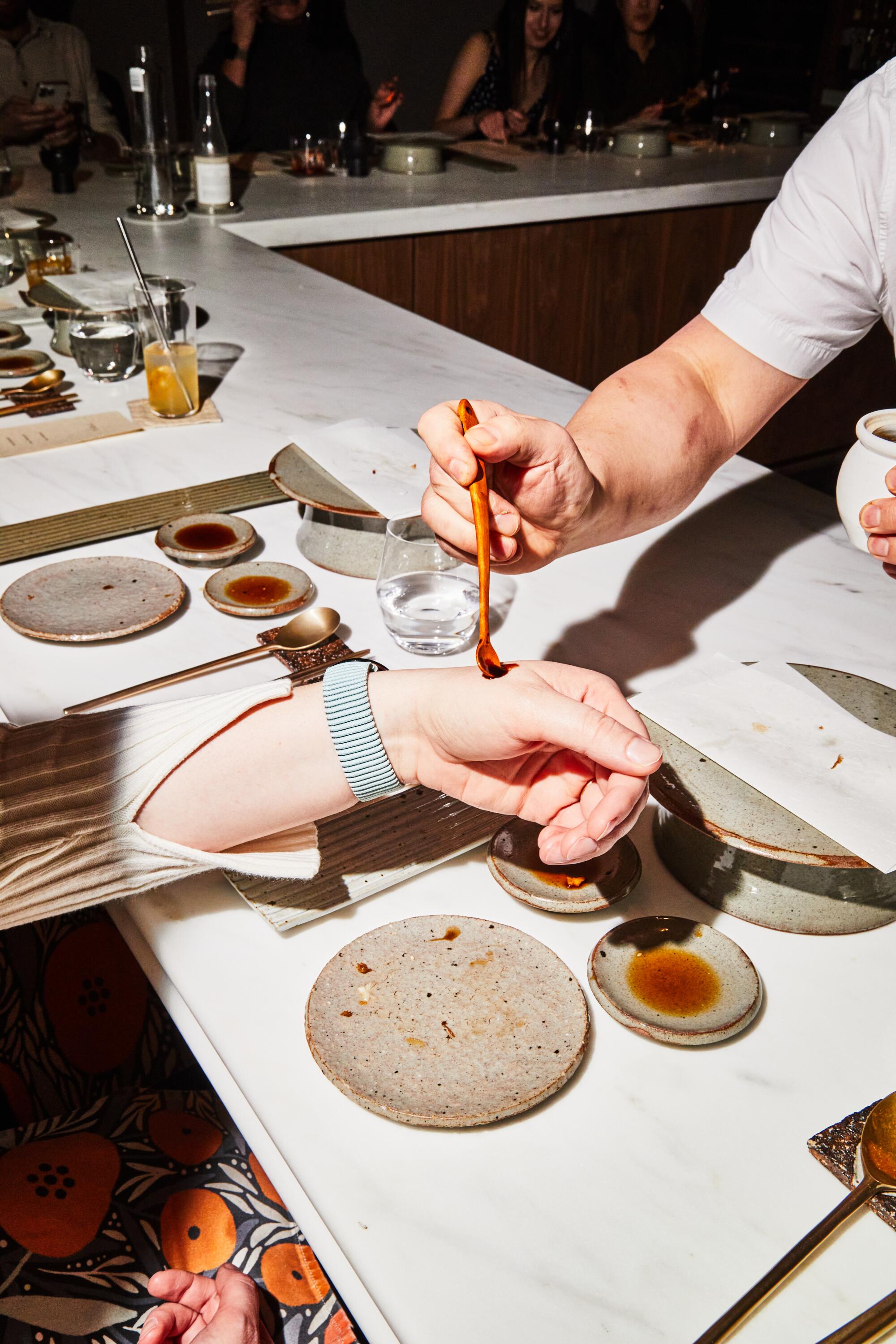 Diners try out 129-year-old soy sauce at Meju in Long Island City, New York. 