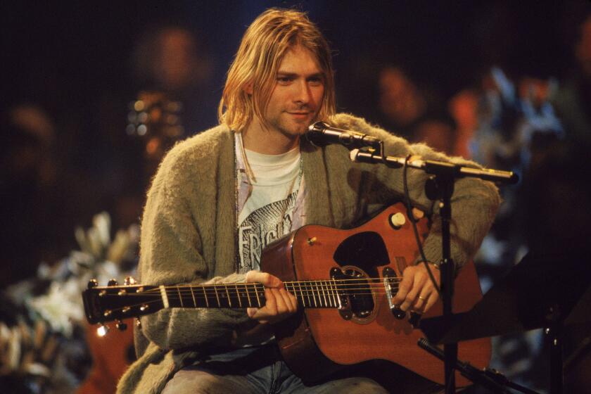 Nirvana singer and guitarist Kurt Cobain performs in 1993 in New York during a taping of "MTV Unplugged."
