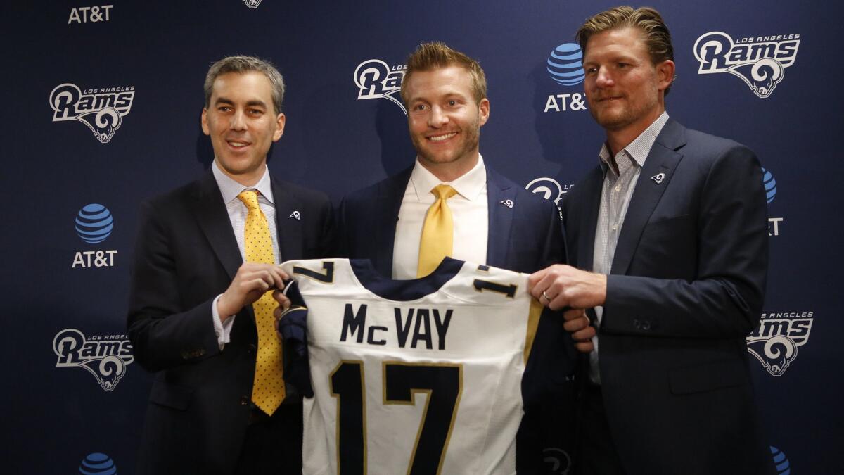Sean McVay, center, the youngest coach in NFL history, poses with Rams COO Kevin Demoff, left, and GM Les Snead after being introduced at team headquarters in Thousand Oaks on Jan. 13, 2017.