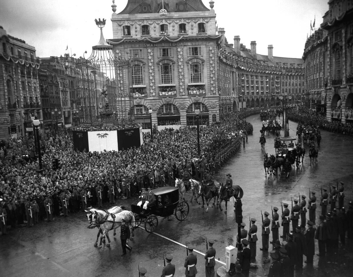 A carriage passes through Picadilly Circus following the coronation of Britain's Queen Elizabeth II.