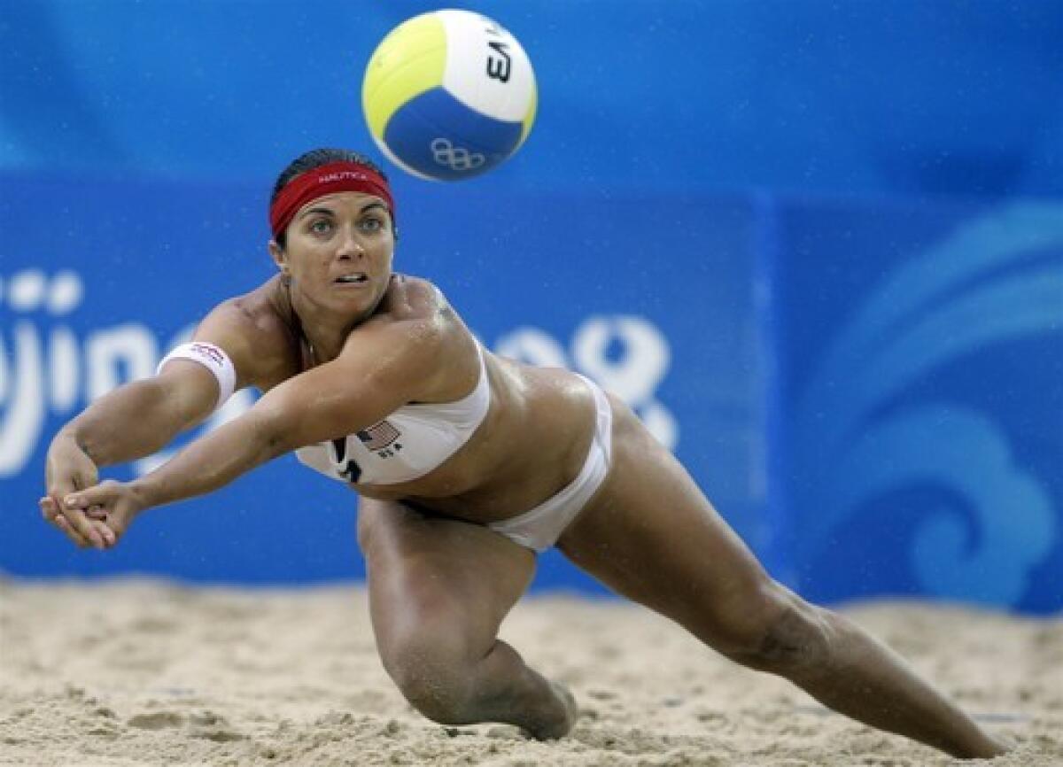 Misty May-Treanor, a native of Costa Mesa, goes for the ball against China in the women's beach volleyball gold-medal match at the 2008 Olympics.