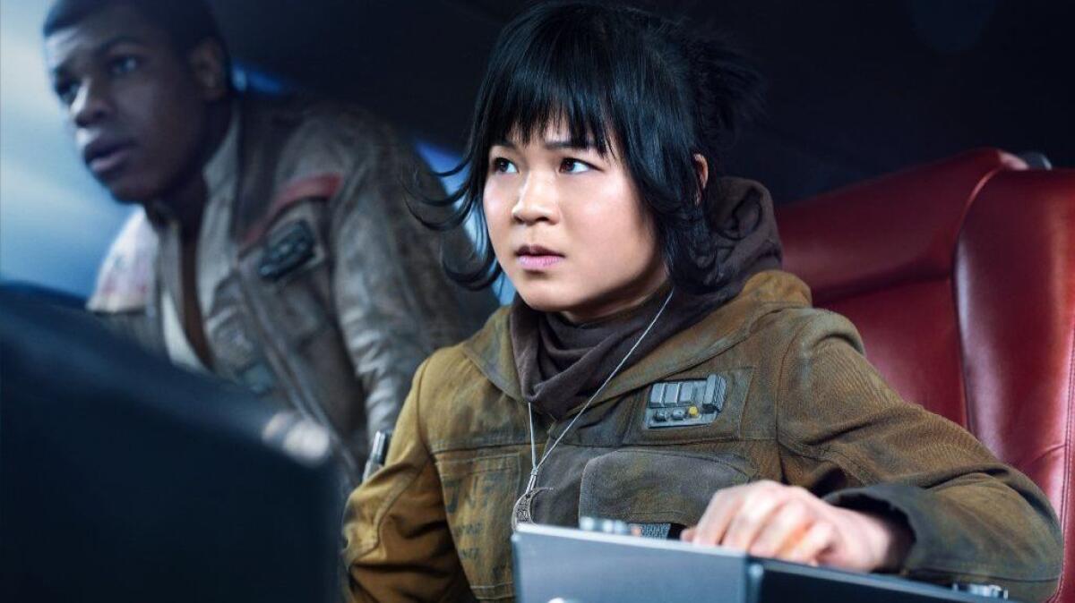 (L-R) - John Boyega as 'Finn' and Kelly Marie Tran as 'Rose' in Rian Johnson's "Star Wars: The Last Jedi."