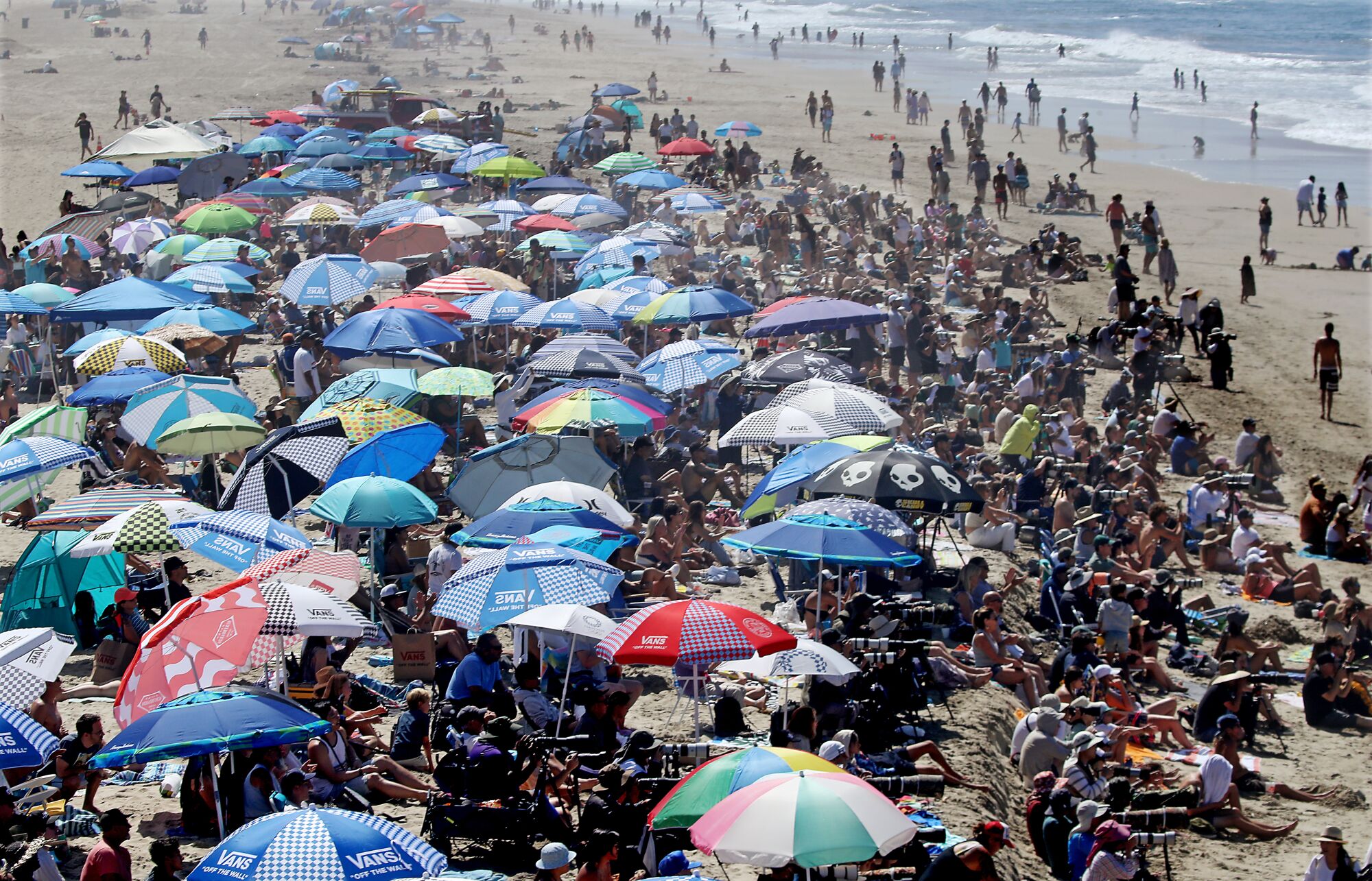 Surfing fans crowd Huntington Beach to watch the finals of the 2022 U.S. Open of Surfing.
