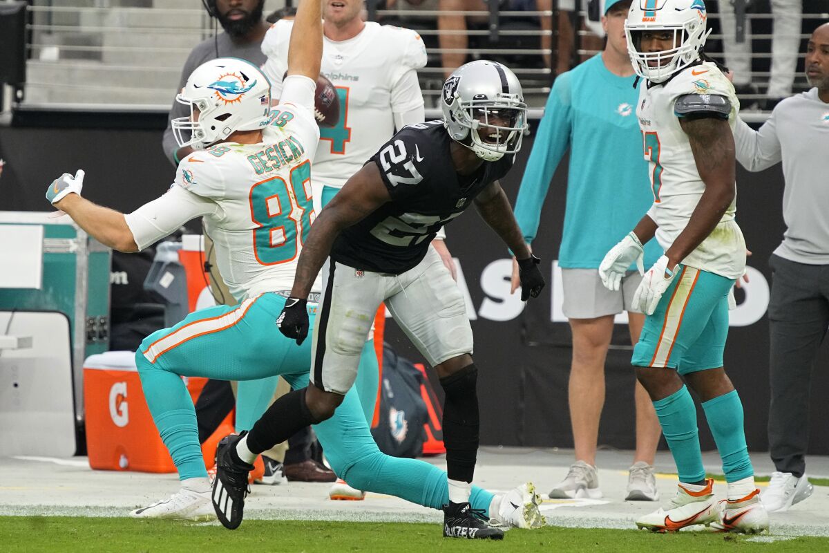 Las Vegas Raiders cornerback Trayvon Mullen (27) reacts after stopping a catch by Miami Dolphins tight end Mike Gesicki (88) during the second half of an NFL football game, Sunday, Sept. 26, 2021, in Las Vegas. (AP Photo/Rick Scuteri)