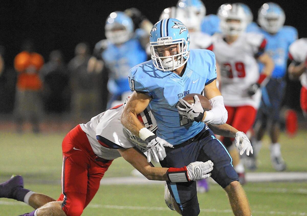 Corona del Mar High's Dylan Tucker runs for a big gain after a catch against Tesoro.