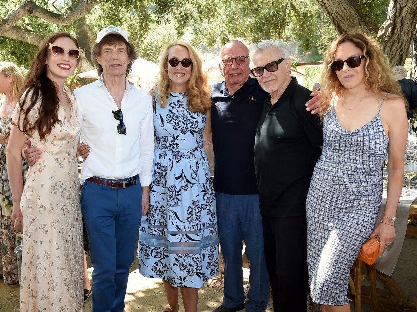 Elizabeth Jagger, from left, Mick Jagger, Jerry Hall and husband Rupert Murdoch, Harvey Keitel and Daphne Kastner at a barbecue lunch to celebrate 30 years of Moraga Bel Air winery in Bel-Air. Murdoch and his wife were hosts of the afternoon gathering.