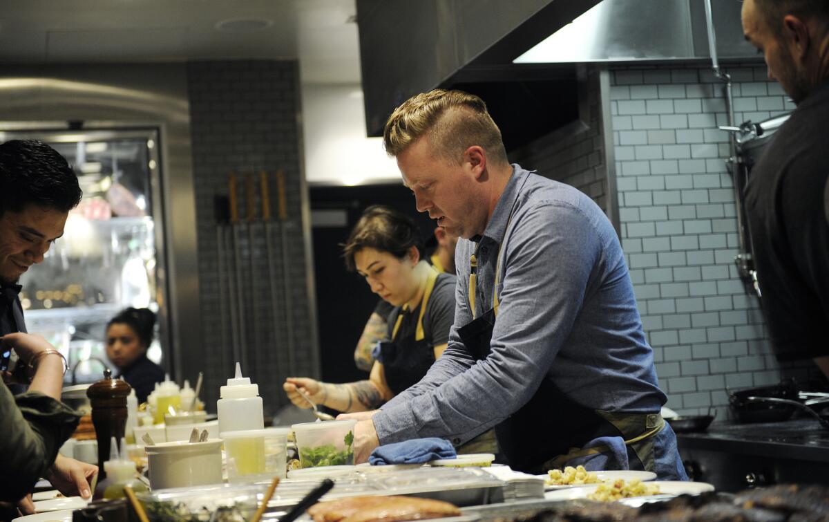 Chef Tim Hollingsworth works alongside his crew at Otium.