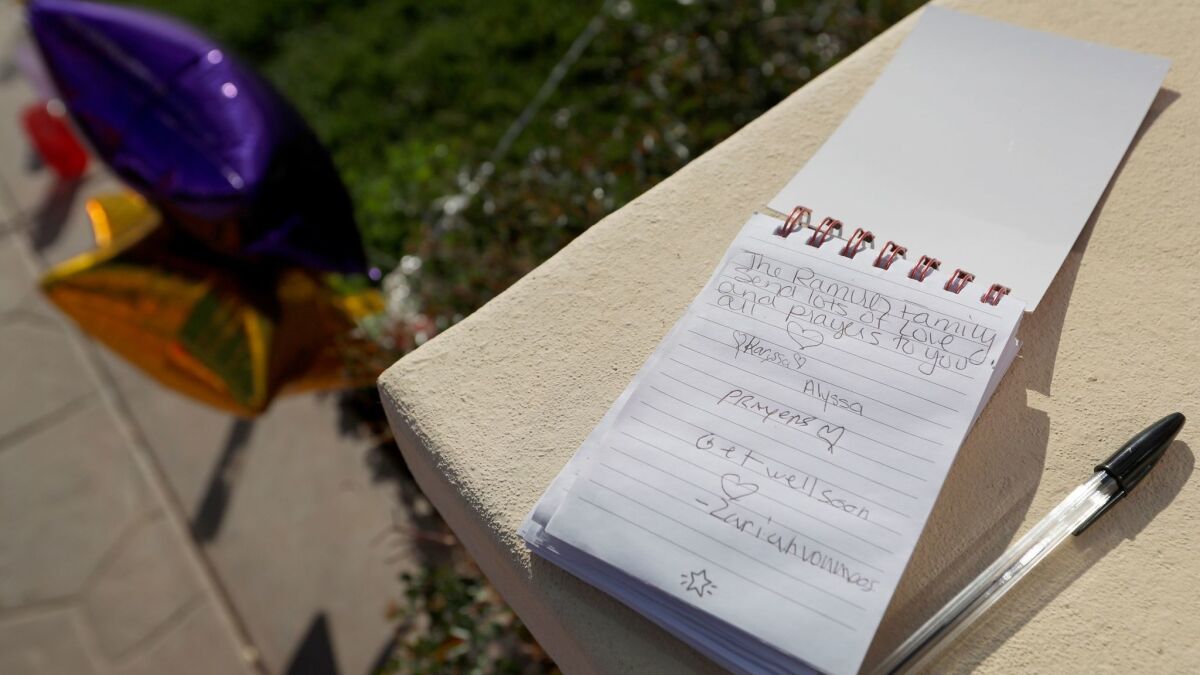 Hand-written notes are part of a growing memorial in Perris for the children of Turpin family.