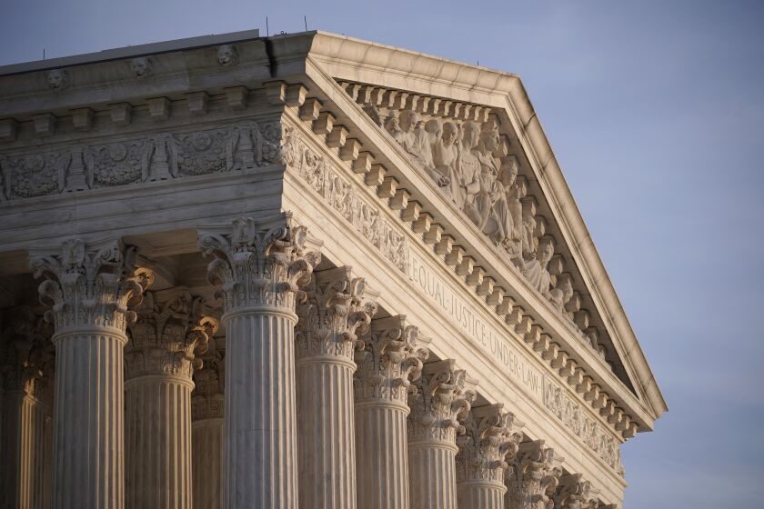 FILE - The Supreme Court is seen in Washington, on Nov. 5, 2020. The Supreme Court has unanimously revived whistleblower lawsuits claiming that supermarket and pharmacy chains SuperValu and Safeway overcharged government health-care programs for prescription drugs by hundreds of millions of dollars. (AP Photo/J. Scott Applewhite, File)