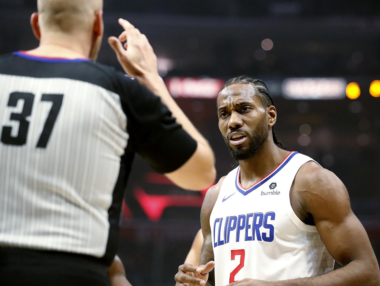 Clippers forward Kawhi Leonard reacts after getting called for an offensive foul against the Celtics during the second quarter of a game Nov. 20 at Staples Center.