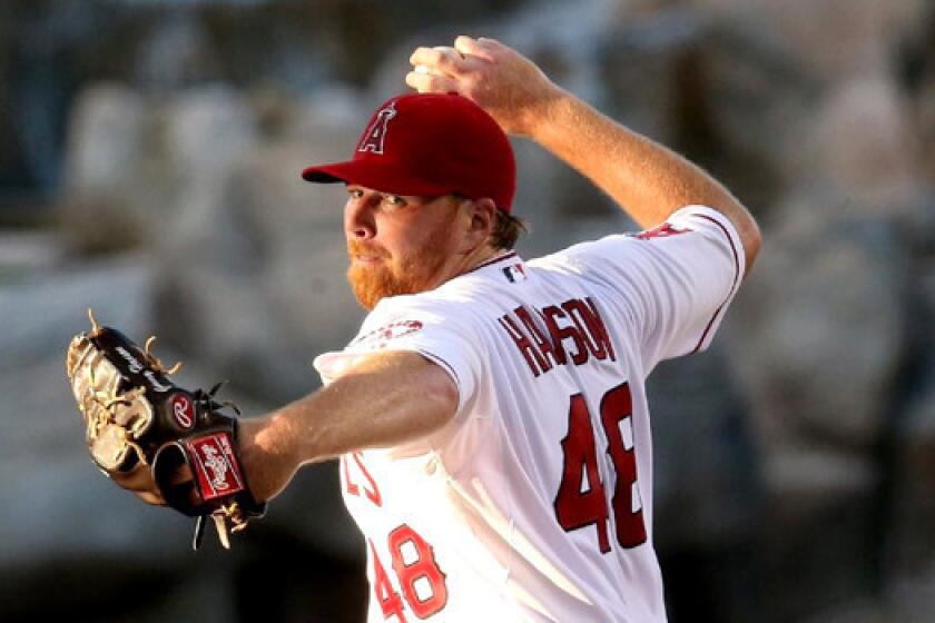 Tommy Hanson was scratched from a start for the Angels against the Detroit Tigers because of tightness in his right forearm.