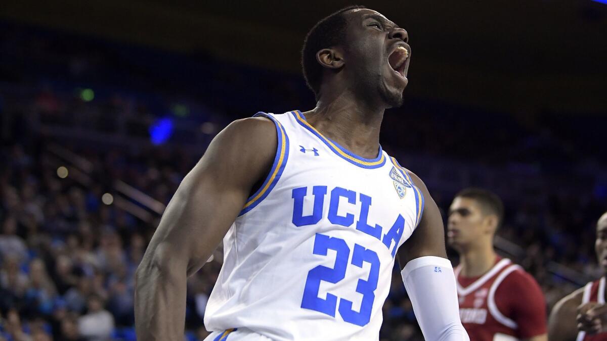 UCLA guard Prince Ali celebrates after dunking during the second half against Stanford.
