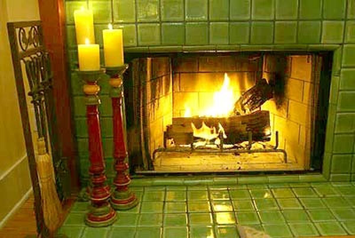 Ted Weiant and Joan Stein added a fireplace in the master bedroom in their L.A. home. The couple prefer almond logs because they tend to burn at the same rate each time.