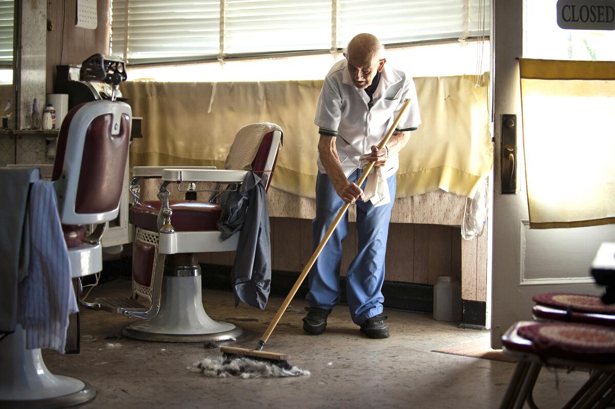 Clean up in Tony's Barbershop, Greenwich, Conn.