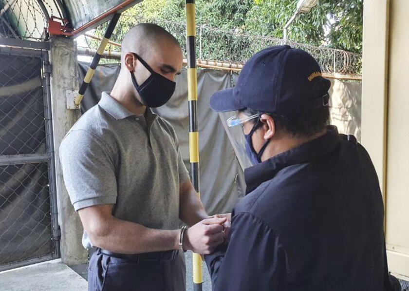 Joseph Scott Pemberton has his handcuffs removed before leaving Camp Aguinaldo in Quezon City, Philippines.