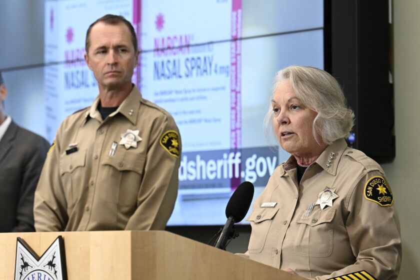 San Diego County Sheriff Kelly Martinez, right, speaks as Assistant Sheriff Brian Nevis looks on at a county news conference held to announce the free distribution of Harm Reduction Kits Jan. 23, 2023 in San Diego. (Photo by Denis Poroy)