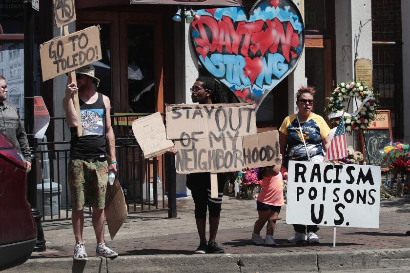 DAYTON, OHIO - AUGUST 07: Anti-Trump demonstrators protest in the Oregon District, where a mass shooting early Sunday morning left nine dead and 27 wounded, on August 07, 2019 in Dayton, Ohio. President Donald Trump visited the city today to offer his support to the community but did not go into the Oregon District where the shooting occurred. The shooting happened less than 24 hours after a gunman in Texas opened fire at a shopping mall in El Paso killing 22 people. Trump is scheduled to visit El Paso later today. (Photo by Scott Olson/Getty Images) ** OUTS - ELSENT, FPG, CM - OUTS * NM, PH, VA if sourced by CT, LA or MoD **