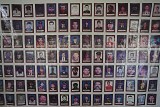 FILE - Photos of people who disappeared during Colombia's internal conflict hang at the entrance of Virgilio Barco Public Library, the site of hearings before the Special Jurisdiction for Peace regarding kidnappings by the Armed Forces of Colombia (FARC) during Colombia's internal conflict in Bogota, Colombia, June 22, 2022. The number of internally displaced people in Colombia increased significantly in 2022 as several armed groups fought for control of rural pockets of the country, the Red Cross said March 22, 2023. (AP Photo/Fernando Vergara, File)
