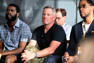 Lance Armstrong, center, and others listen to a panel discussion during SXSW on March 11 in Austin, Texas.