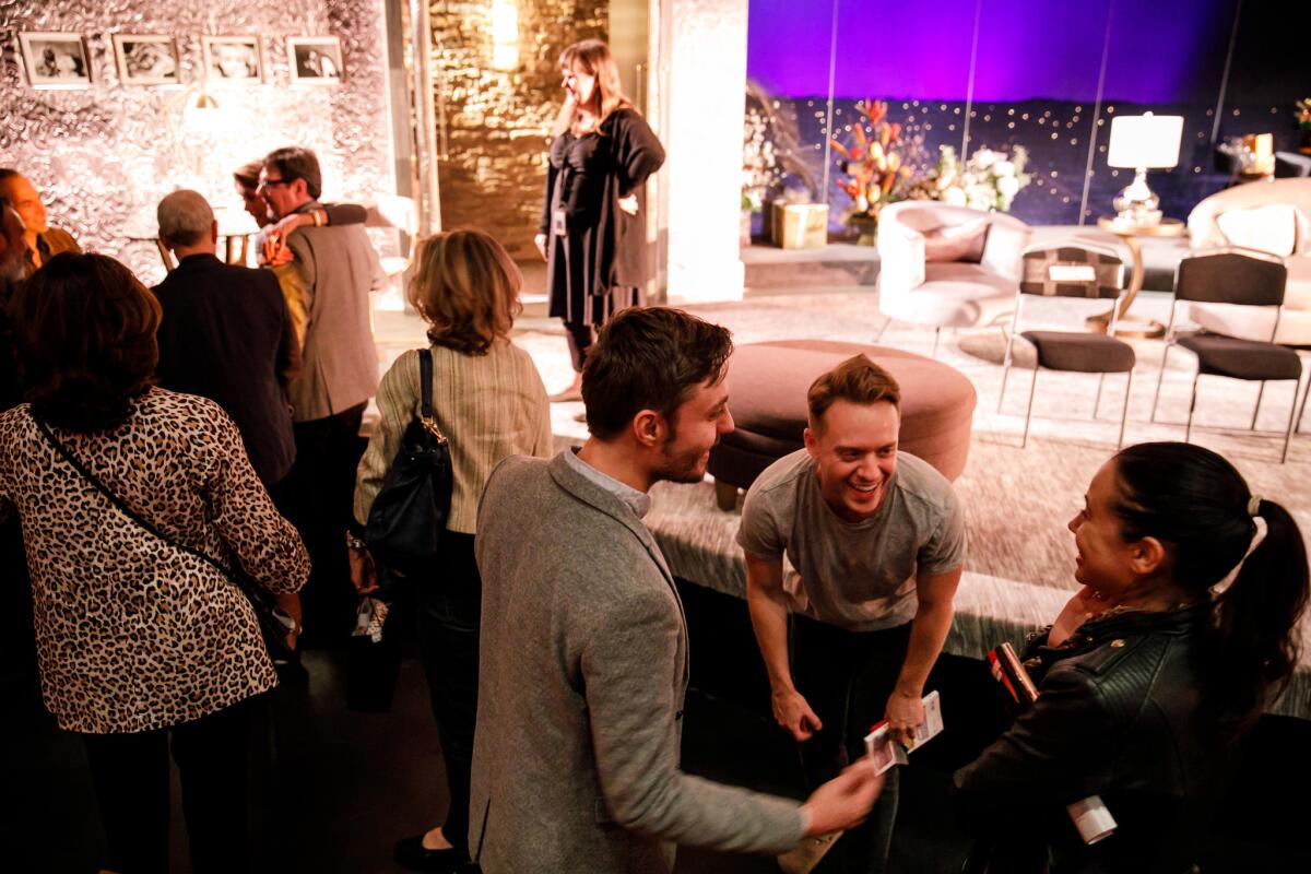 "Big Night" actor Max Jenkins, second from right, talks to audience members after the show. (Marcus Yam / Los Angeles Times)