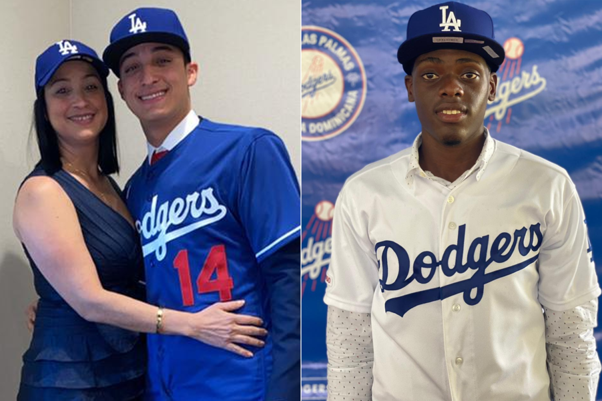 Prospects Jesus Galiz, left, (standing with his mother) and Rayne Doncon each signed with the Dodgers on Friday.
