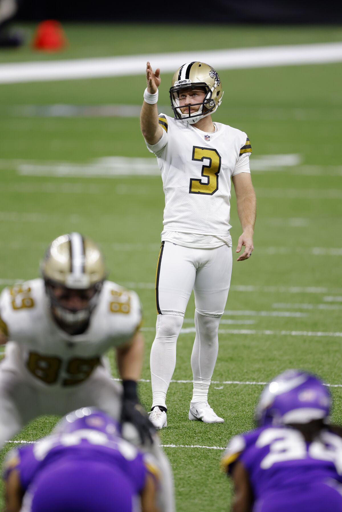 FILE - New Orleans Saints kicker Wil Lutz (3) is shown during an NFL football game against the Minnesota Vikings in New Orleans, in this Friday, Dec. 25, 2020, file photo. Lutz has scheduled surgery to a repair a core muscle injury and it is unclear if he'll return in time for the regular season. Lutz announced the procedure with a post on social media and Saints coach Sean Payton said the Saints would have to work out kickers and sign a new one “at least" for the preseason.Lutz, who has played in every game for New Orleans since making the team as an undrafted rookie out of Georgia State in 2016, was the only kicker on the roster heading into Monday's, Aug. 9, 2021, practice. (AP Photo/Tyler Kaufman, File)