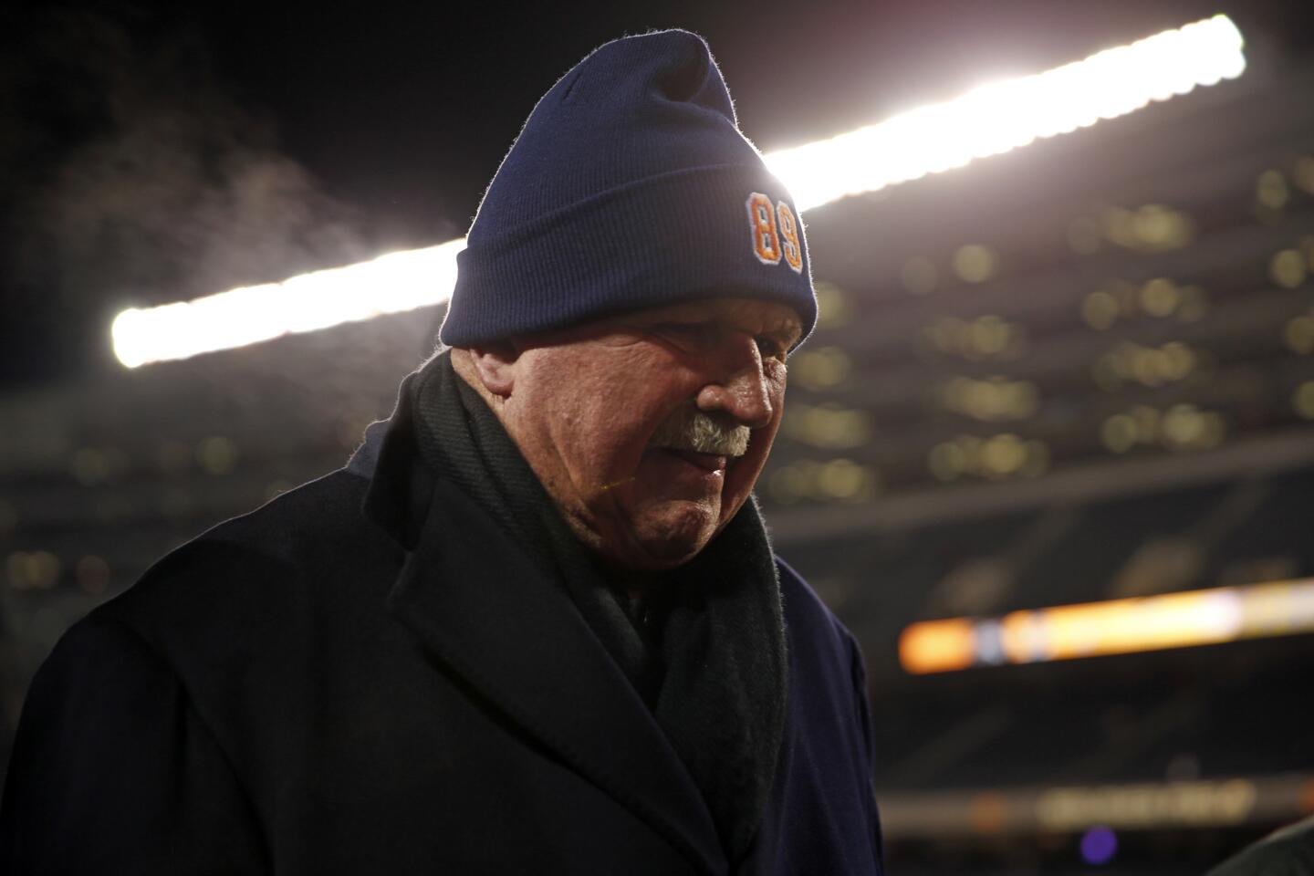 Mike Ditka walks off the field after appearing on ESPN's pregame show.