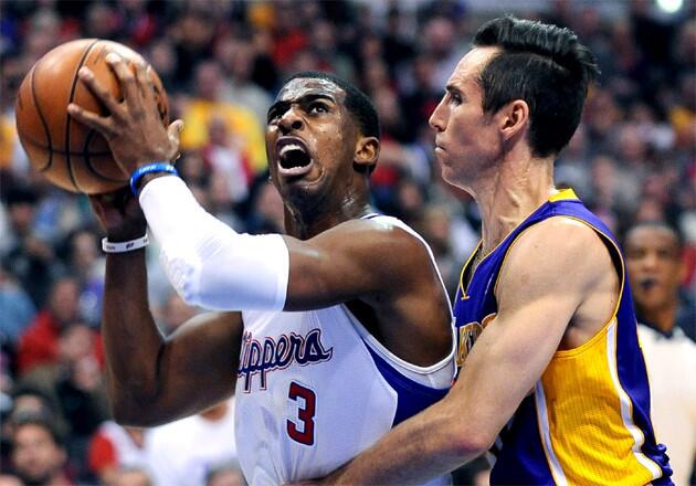 Clippers point guard Chris Paul drives to the basket against Lakers' Steve Nash.