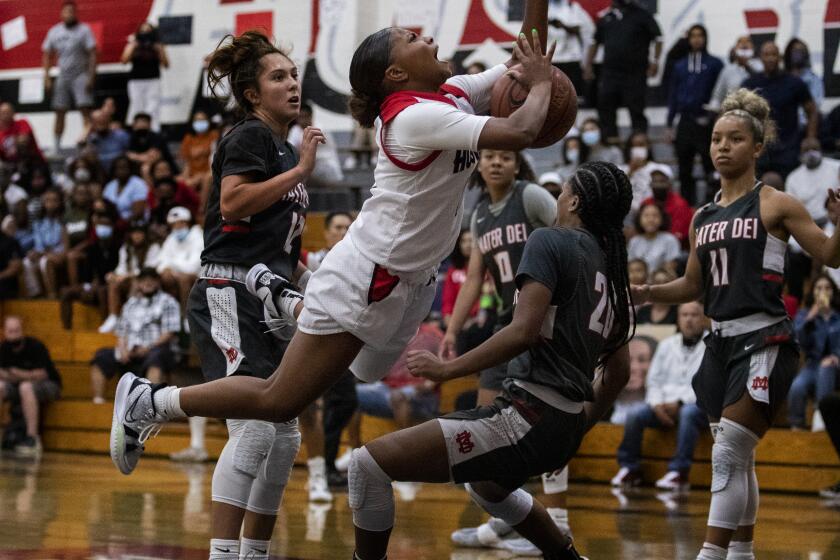 CORONA, CA - JUNE 10, 2021: Corona Centennial Londynn Jones (3) is fouled by Mater Dei Ayana Johnson (20) in the Southern Section Open Division Championship on June 10 2021 in Corona, California.(Gina Ferazzi / Los Angeles Times)