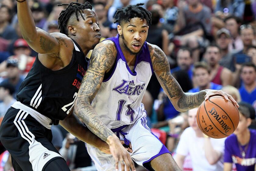LAS VEGAS, NEVADA JULY 7, 2017-Lakers Brandon Ingram drives on Clippers Jaron Johnson during the NBA Summer League at the Thomas and Mack Center in Las Vegas Friday. (Wally Skalij/Los Angeles Times)
