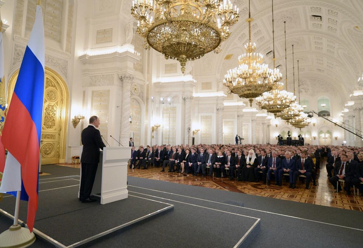Russian President Vladimir Putin delivers his annual state of the nation address at the Kremlin in Moscow on Thursday.