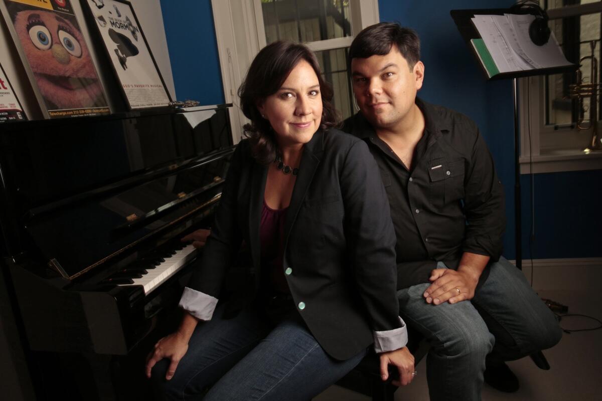 Songwriters Kristen Anderson-Lopez and Robert Lopez of "Frozen" fame are working on a musical number for Oscars host Neil Patrick Harris. Above, the collaborating couple at their home in Brooklyn in 2013.