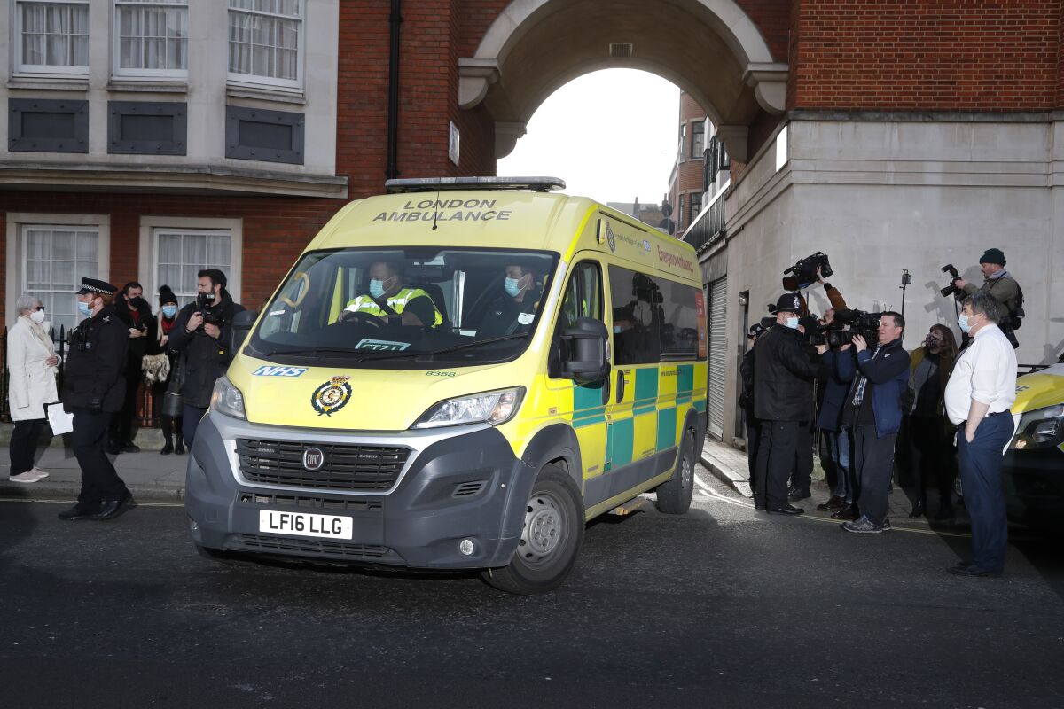 An ambulance drives out of a London hospital where Prince Philip had been getting treatment.