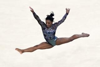 Simone Biles, of United States, performs on floor exercise during a women's artistic gymnastics.
