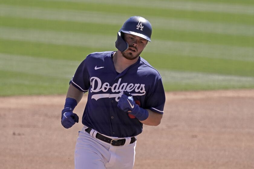 Los Angeles Dodgers' Gavin Lux runs the bases after hitting a solo home run during the first inning of a spring training baseball game against the Cleveland Guardians Wednesday, March 23, 2022, in Glendale, Ariz. (AP Photo/Charlie Riedel)