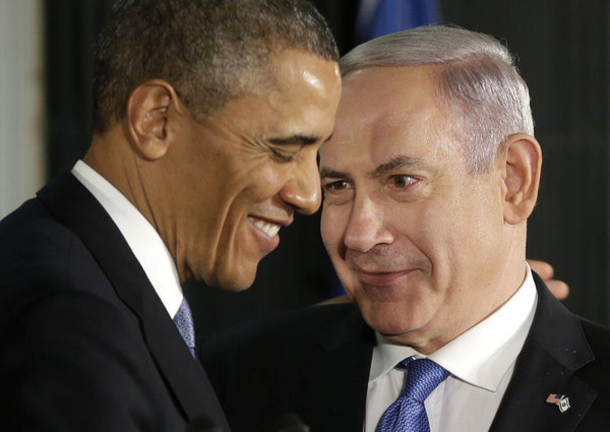 President Obama and Israeli Prime Minister Benjamin Netanyahu huddle during their joint news conference in Jerusalem.
