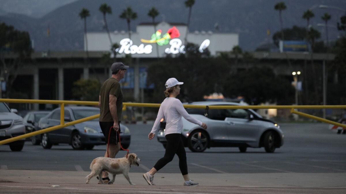 Police blocked the road around parking Lot K, where a man was stabbed and found dead at the Rose Bowl in Pasadena.