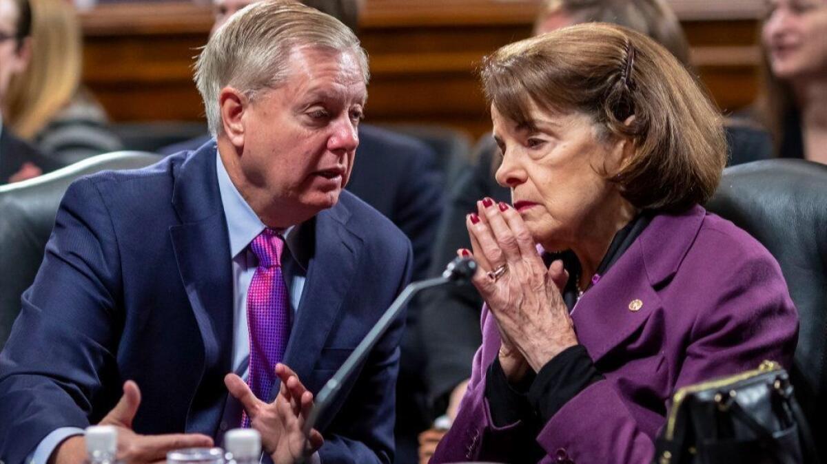 Senate Judiciary Committee Chairman Lindsey Graham (R-S.C.), left, and Sen. Dianne Feinstein (D-Calif.), the ranking member, confer as the panel meets on Capitol Hill in Washington, Tuesday, Jan. 29, 2019.