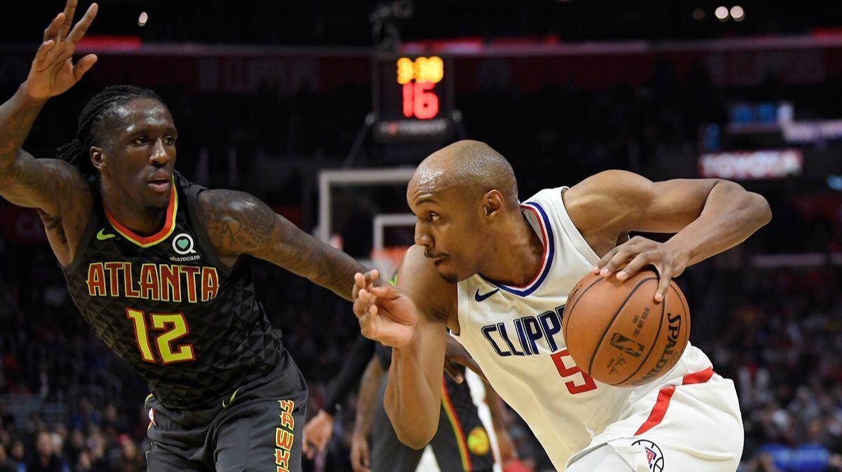 Clippers guard C.J. Williams, driving by Hawks forward Taurean Prince, hit the game-winning three-pointer Monday against Atlanta.
