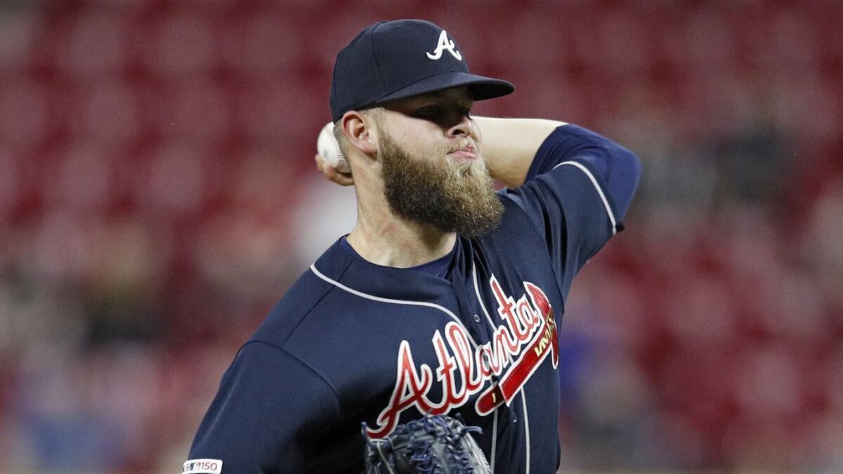 Atlanta Braves reliever A.J. Minter delivers a pitch against the New York Mets on April 14. Minter has seen plenty of innings — and plenty of struggles — so far this season.