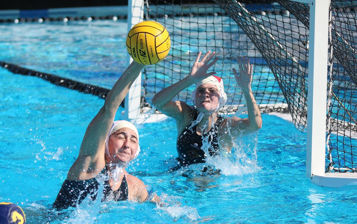 Junior Sophia Press and goalie Campbell Bush.