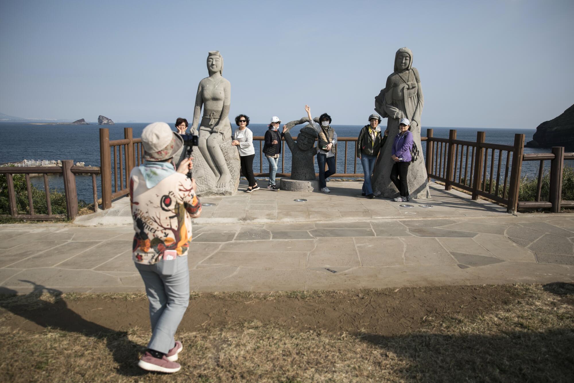 A visitor snaps photos on Jeju Island.