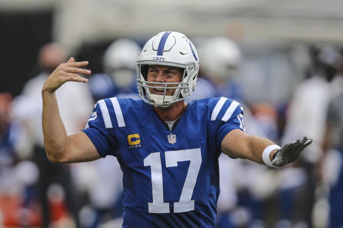 Indianapolis Colts quarterback Philip Rivers signals to a receiver before taking a snap against the Jacksonville Jaguars.